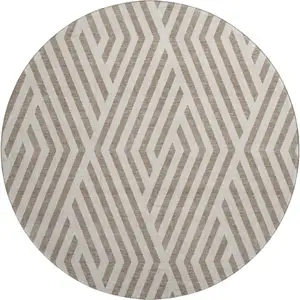 Photo of 8' Taupe And Ivory Geometric Washable Round Rug With UV Protection