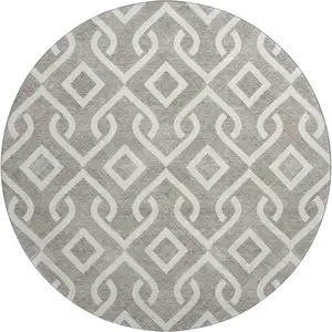 Photo of 8' Taupe And Ivory Geometric Washable Round Rug With UV Protection