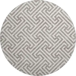 Photo of 8' Taupe And Ivory Geometric Washable Round Rug With UV Protection