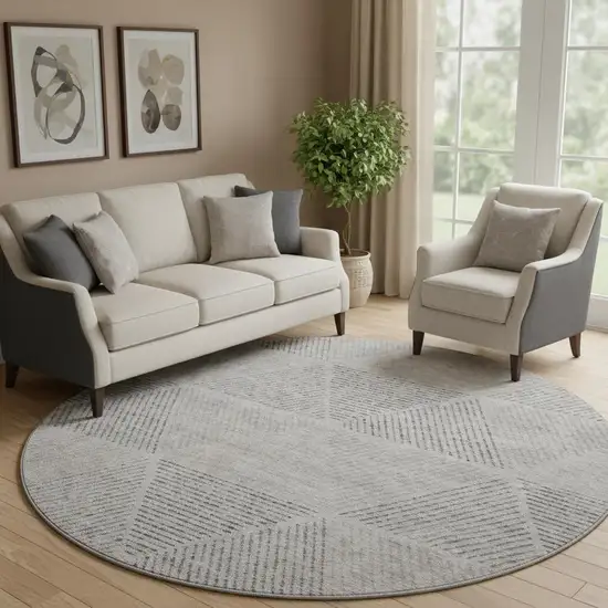 8' Taupe And Ivory Geometric Washable Round Rug With UV Protection Photo 1