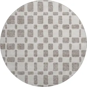 Photo of 8' Taupe And Ivory Geometric Washable Round Rug With UV Protection