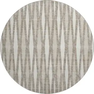 Photo of 8' Taupe And Ivory Geometric Washable Round Rug With UV Protection