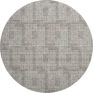 Photo of 8' Taupe And Ivory Geometric Washable Round Rug With UV Protection