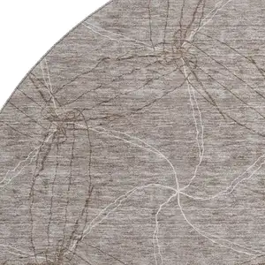 Photo of 8' Taupe And Ivory Geometric Washable Round Rug With UV Protection