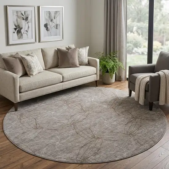 8' Taupe And Ivory Geometric Washable Round Rug With UV Protection Photo 1