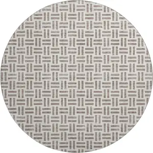 Photo of 8' Taupe And Ivory Geometric Washable Round Rug With UV Protection