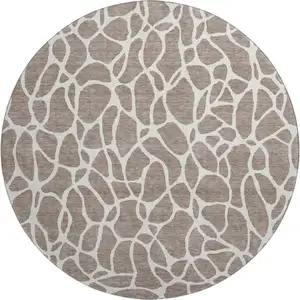 Photo of 8' Taupe And Ivory Geometric Washable Round Rug With UV Protection