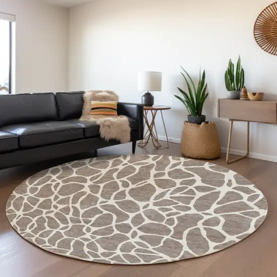 8' Taupe And Ivory Geometric Washable Round Rug With UV Protection Photo 4