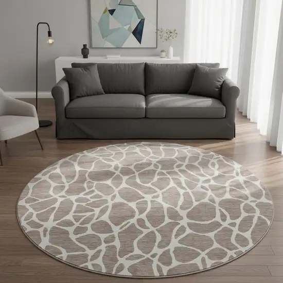 8' Taupe And Ivory Geometric Washable Round Rug With UV Protection Photo 2