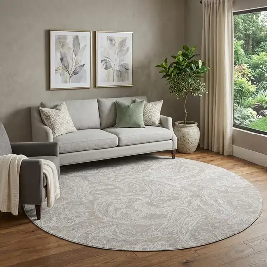 8' Taupe And Ivory Paisley Washable Round Rug With UV Protection Photo 1