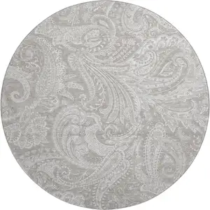 Photo of 8' Taupe And Ivory Paisley Washable Round Rug With UV Protection