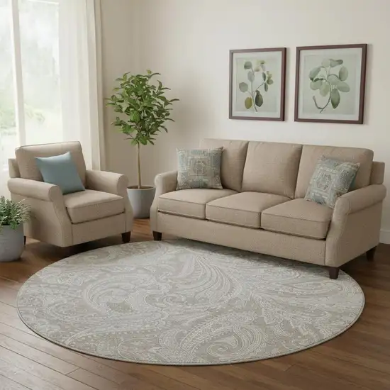 8' Taupe And Ivory Paisley Washable Round Rug With UV Protection Photo 1
