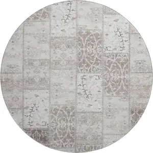 Photo of 8' Taupe And Ivory Patchwork Washable Round Rug With UV Protection