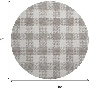Photo of 8' Taupe And Ivory Plaid Washable Round Rug With UV Protection