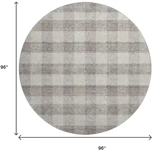 Photo of 8' Taupe And Ivory Plaid Washable Round Rug With UV Protection