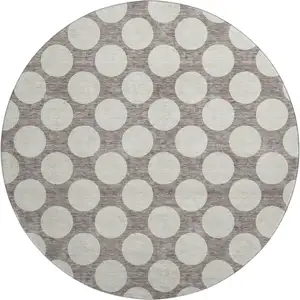 Photo of 8' Taupe And Ivory Polka Dot Washable Round Rug With UV Protection