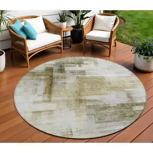 Photo of 8' Taupe And Ivory Round Abstract Washable Indoor Outdoor Area Rug