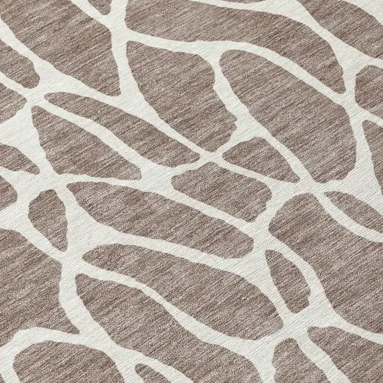 8' Taupe And Ivory Round Geometric Washable Indoor Outdoor Area Rug Photo 8