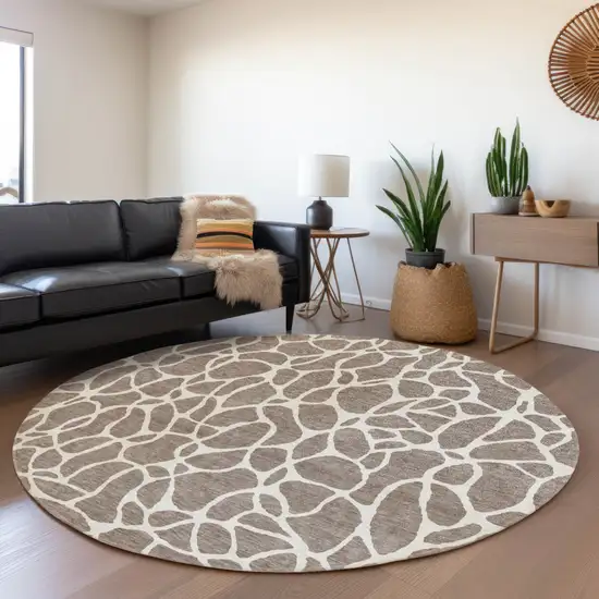 8' Taupe And Ivory Round Geometric Washable Indoor Outdoor Area Rug Photo 7