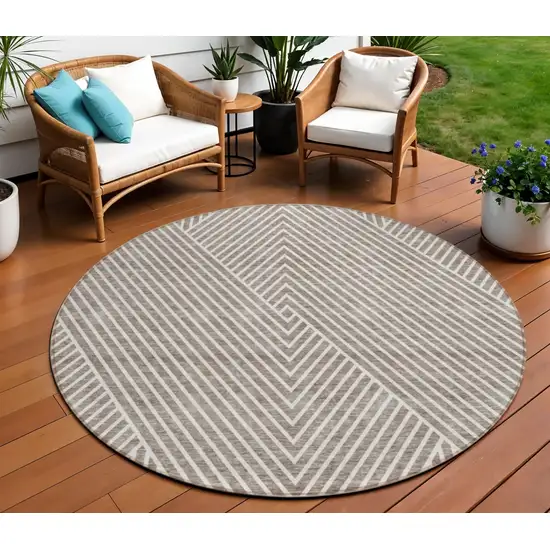 8' Taupe And Ivory Round Geometric Washable Indoor Outdoor Area Rug Photo 1