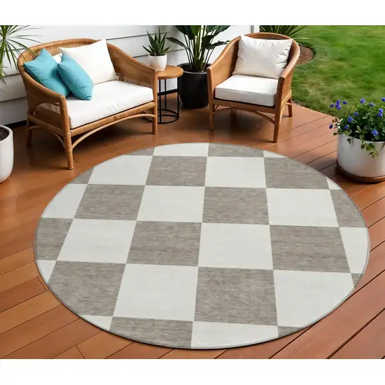 8' Taupe And Ivory Round Geometric Washable Indoor Outdoor Area Rug Photo 1
