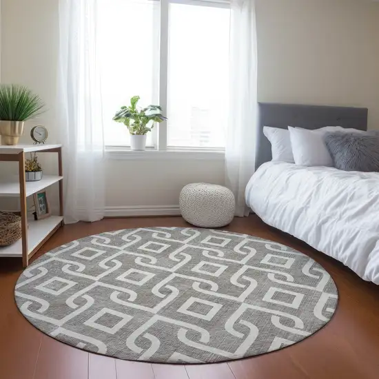 8' Taupe And Ivory Round Geometric Washable Indoor Outdoor Area Rug Photo 7