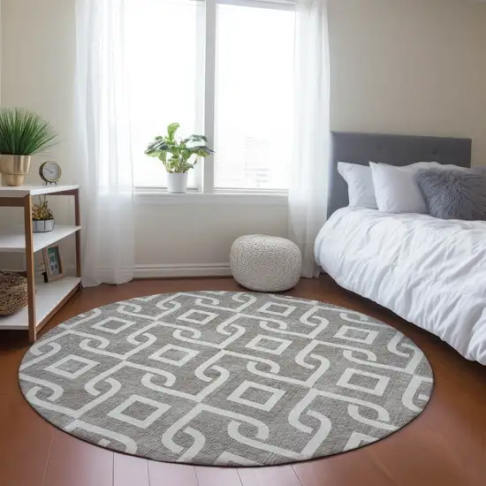 8' Taupe And Ivory Round Geometric Washable Indoor Outdoor Area Rug Photo 7