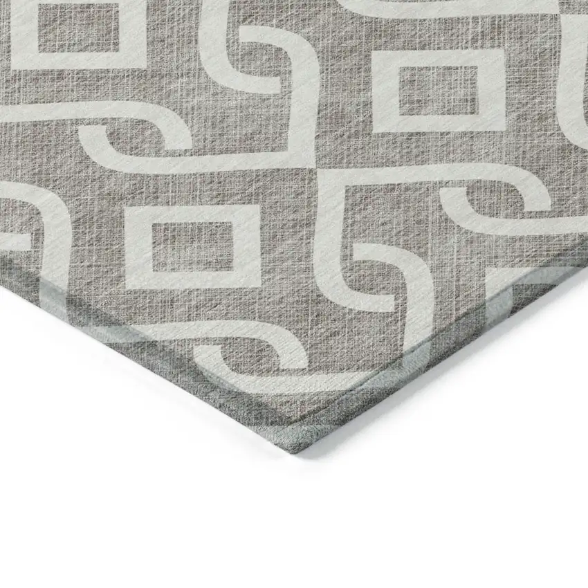 8' Taupe And Ivory Round Geometric Washable Indoor Outdoor Area Rug Photo 4