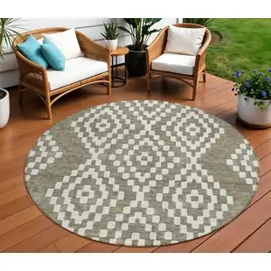 Photo of 8' Taupe And Ivory Round Geometric Washable Indoor Outdoor Area Rug