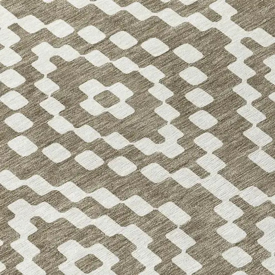 8' Taupe And Ivory Round Geometric Washable Indoor Outdoor Area Rug Photo 4