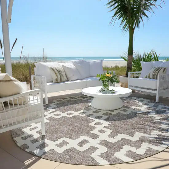 8' Taupe And Ivory Round Geometric Washable Indoor Outdoor Area Rug Photo 6