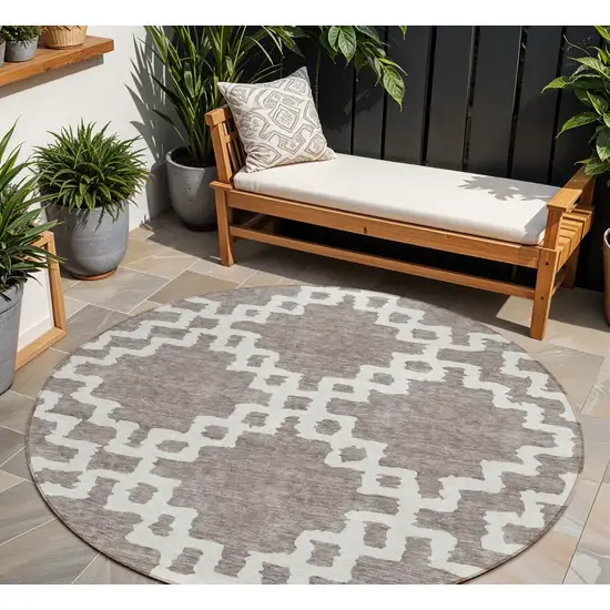 8' Taupe And Ivory Round Geometric Washable Indoor Outdoor Area Rug Photo 1