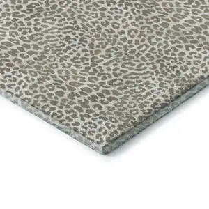 Photo of 8' Taupe And Ivory Round Leopard Print Washable Indoor Outdoor Area Rug