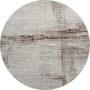 Photo of 8' Taupe And Ivory Striped Washable Round Rug With UV Protection