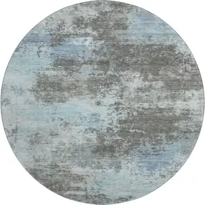 Photo of 8' Taupe And Sky Blue Abstract Washable Round Rug With UV Protection