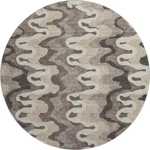 Photo of 8' Taupe Beige And Brown Abstract Washable Round Rug With UV Protection