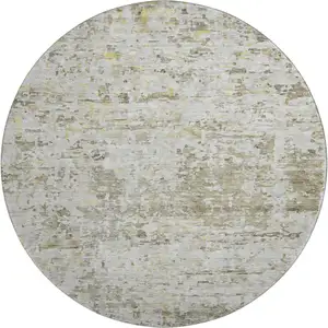 Photo of 8' Taupe Beige And Gold Abstract Washable Round Rug With UV Protection
