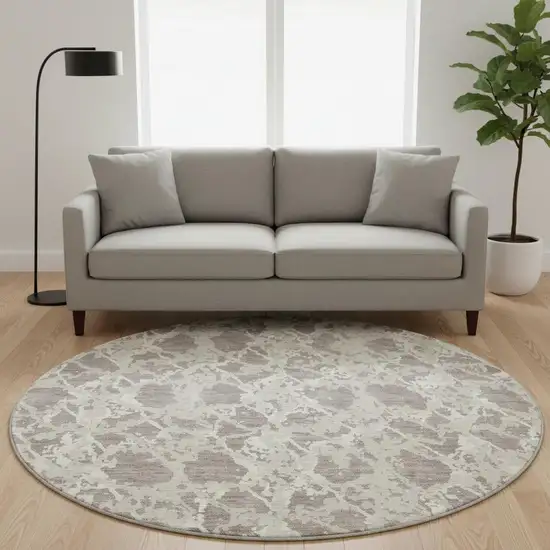 8' Taupe Beige And Ivory Abstract Washable Round Rug With UV Protection Photo 2