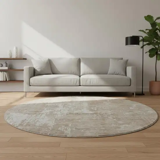 8' Taupe Beige And Ivory Abstract Washable Round Rug With UV Protection Photo 2