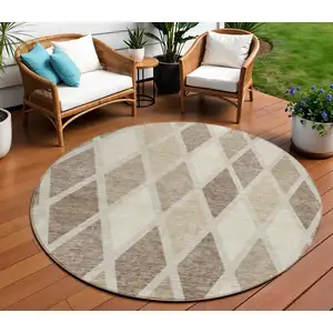 Photo of 8' Taupe Beige And Ivory Round Geometric Washable Indoor Outdoor Area Rug
