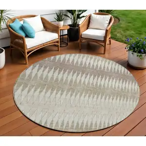 Photo of 8' Taupe Beige And Ivory Round Striped Washable Indoor Outdoor Area Rug