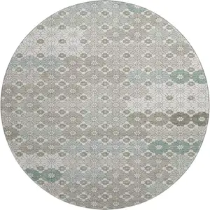 Photo of 8' Taupe Beige And Teal Geometric Washable Round Rug With UV Protection