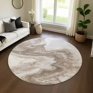 Photo of 8' Taupe Brown And Ivory Abstract Washable Round Rug With UV Protection