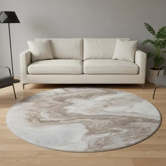 8' Taupe Brown And Ivory Abstract Washable Round Rug With UV Protection Photo 2