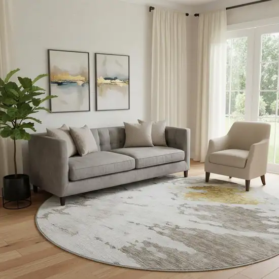 8' Taupe Gold And Ivory Abstract Washable Round Rug With UV Protection Photo 1