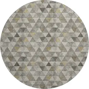 Photo of 8' Taupe Gold And Ivory Geometric Washable Round Rug With UV Protection
