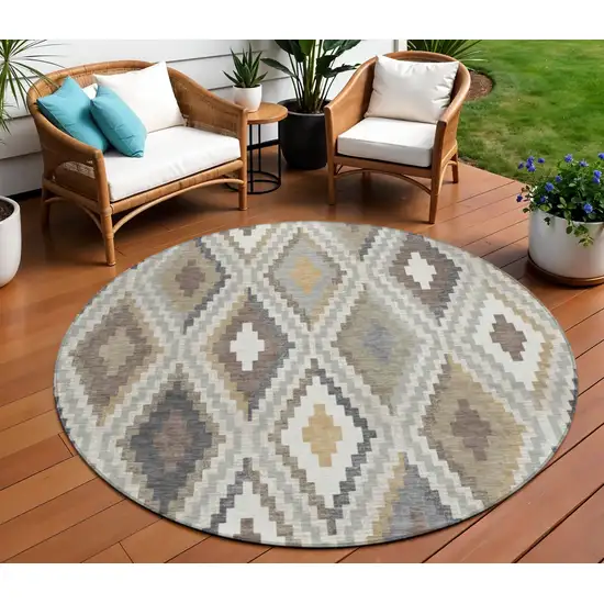 8' Taupe Gold And Ivory Round Geometric Washable Indoor Outdoor Area Rug Photo 1