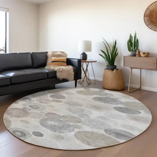 8' Taupe Gray And Beige Round Geometric Washable Indoor Outdoor Area Rug Photo 6