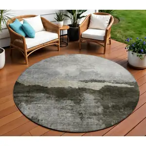 Photo of 8' Taupe Gray And Black Round Abstract Washable Indoor Outdoor Area Rug