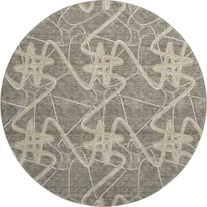 Photo of 8' Taupe Gray And Gold Geometric Washable Round Rug With UV Protection